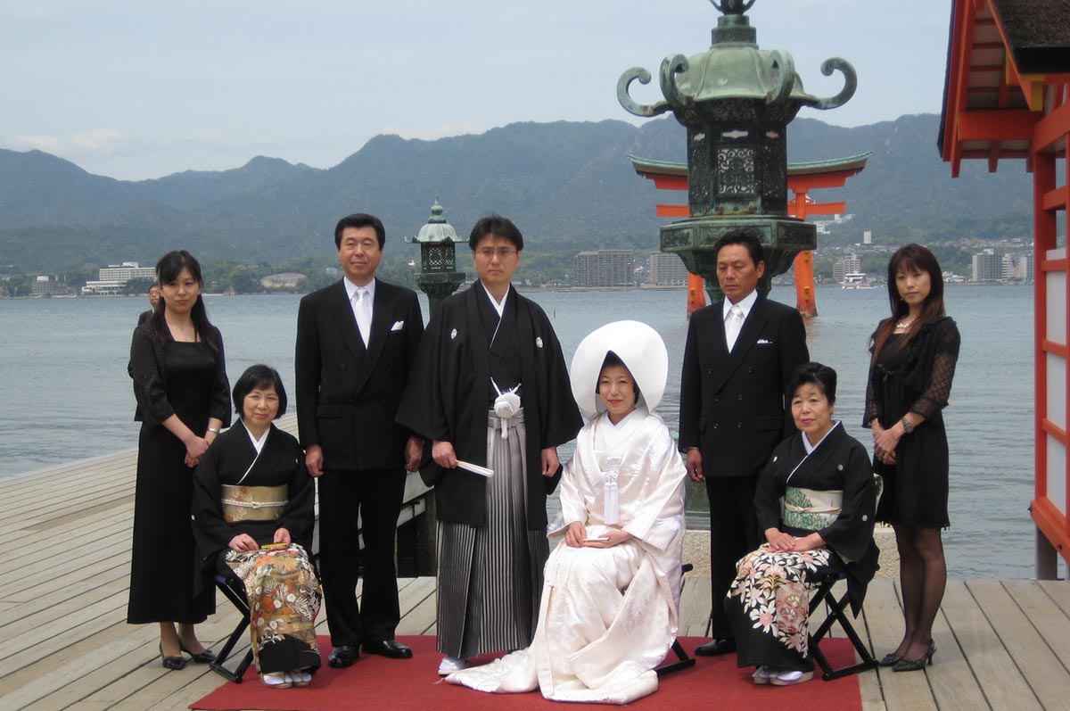 Details of a Japanese kimono and purse at a shinto wedding on