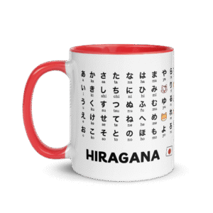 White ceramic mug printed with the full Japanese Hiragana chart and romaji pronunciation guide